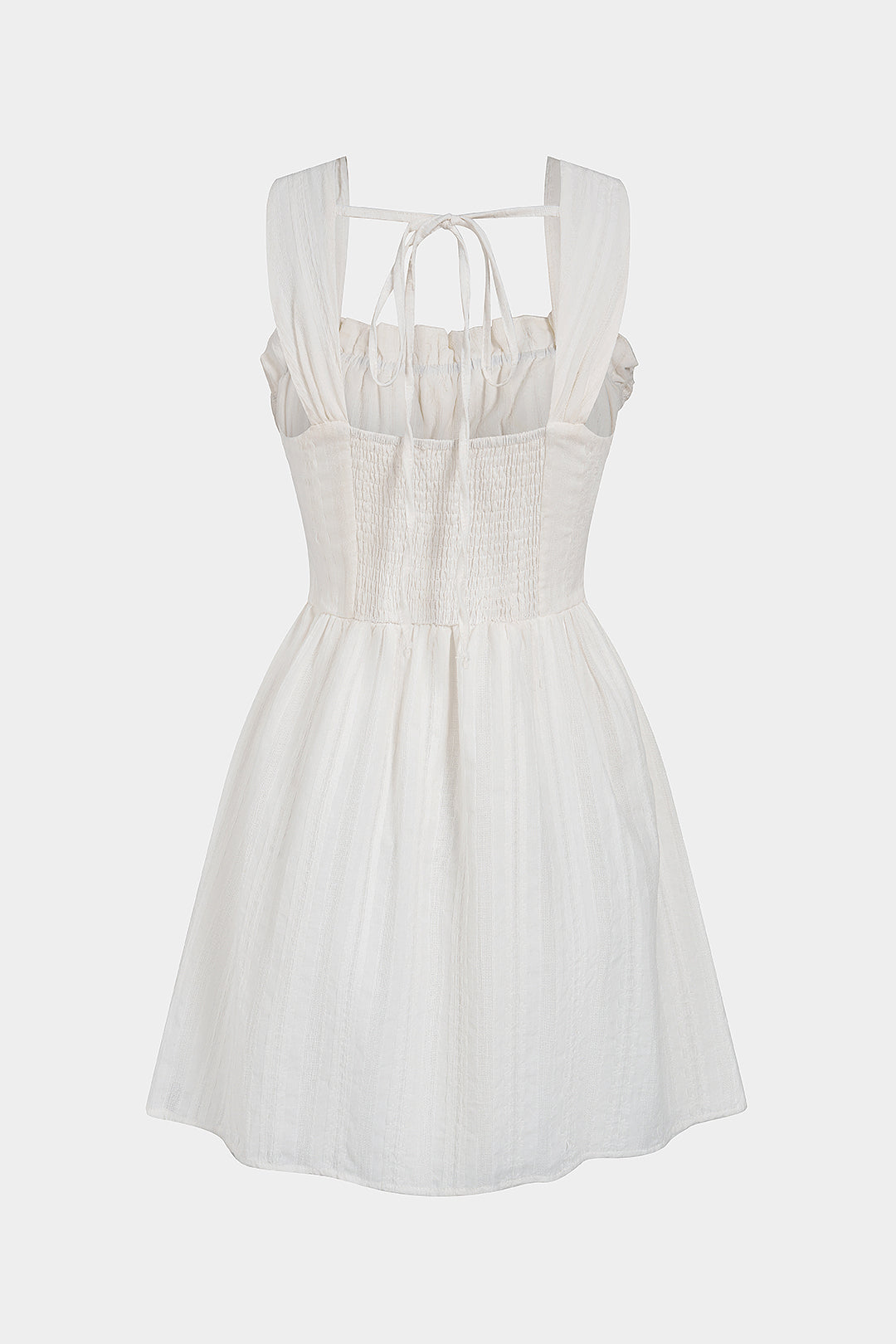 Mini-robe sans manches à patchwork et garniture en dentelle avec liens à nouer
