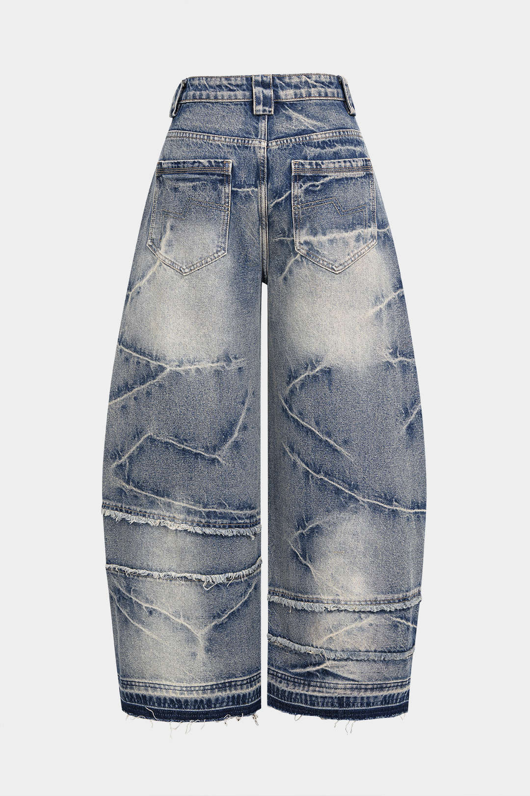 Jeans larges asymétriques en denim effiloché