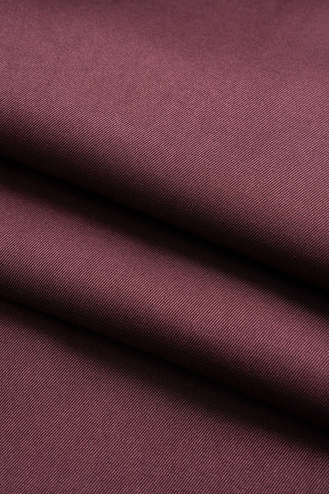 Hose aus Kunstleder-Patchwork mit asymmetrischem Metallic-Knopf und weitem Bein