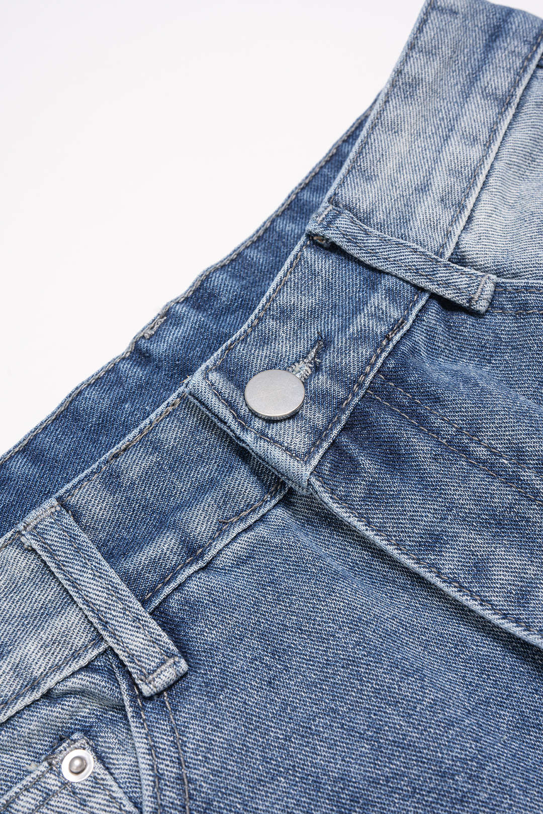 Jean en denim avec poche asymétrique