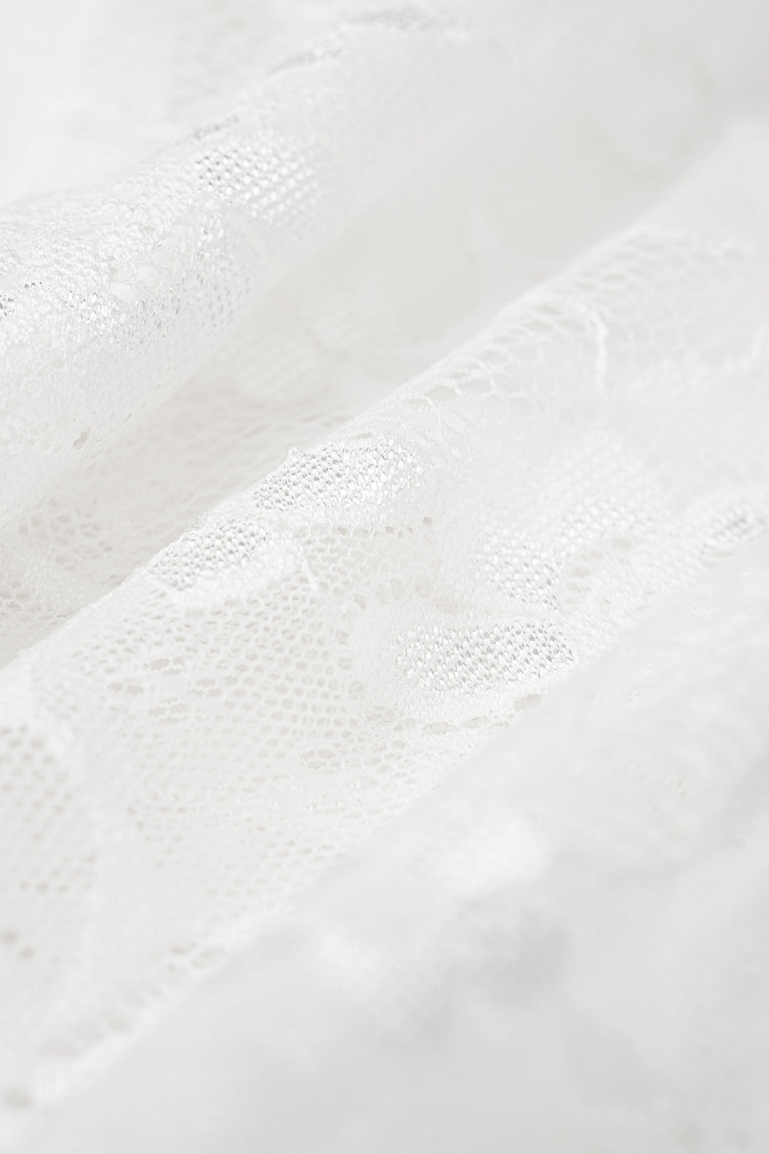 Robe longue sans manches dos nu à bretelles en patchwork de dentelle