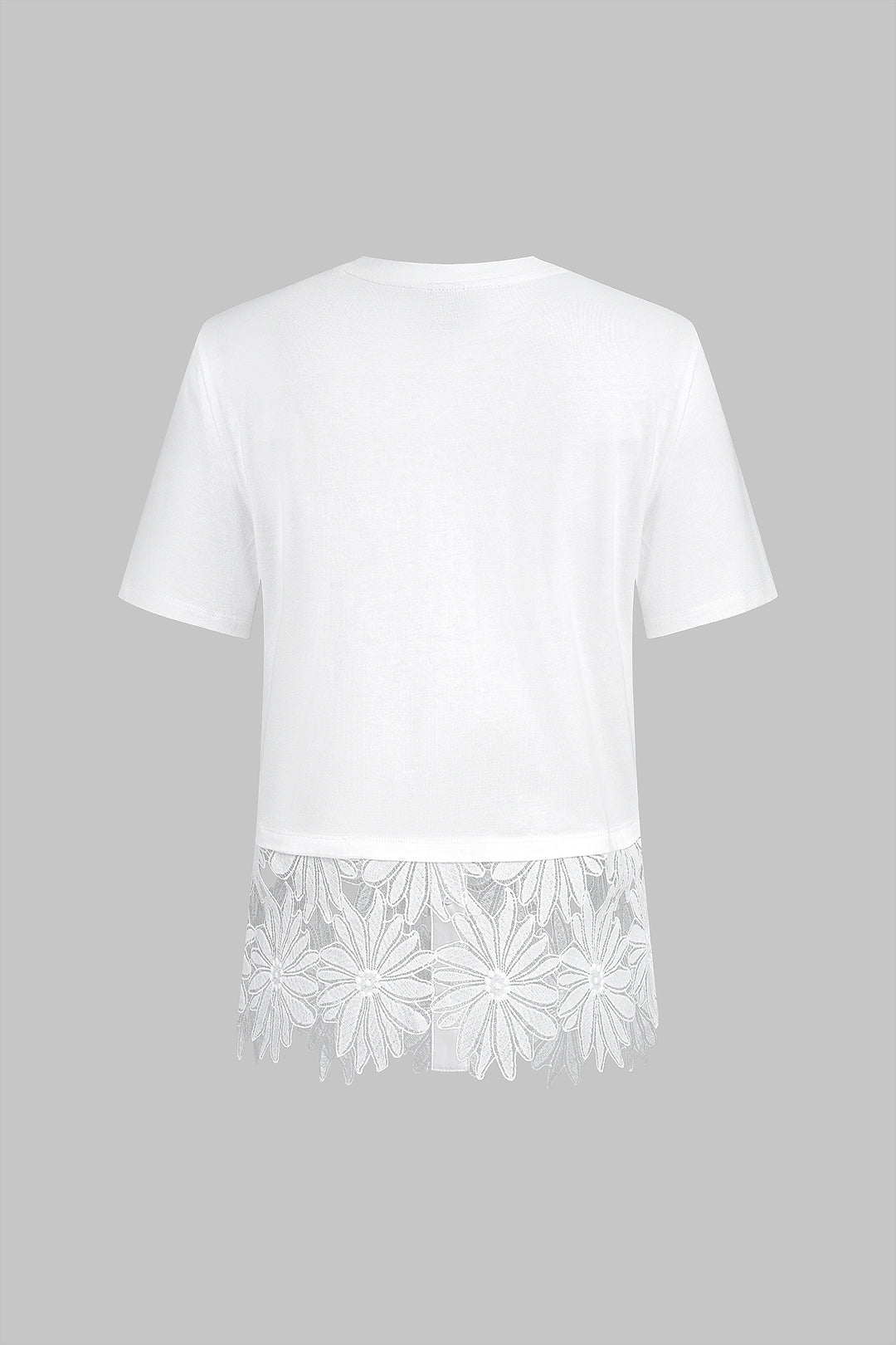 T-shirt uni à patchwork, col rond, ourlet fleuri et manches courtes